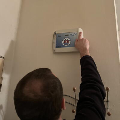 Removing moisture in a 100-year-old house using electroosmosis